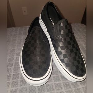 Never worn Black checker Off the Wall slip on Vans
